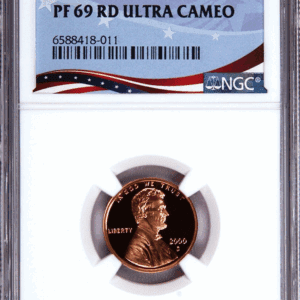 Graded 2000 penny in protective holder.