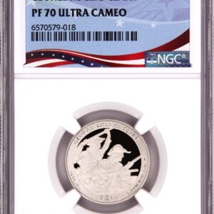 Graded silver coin with eagle design in protective case.