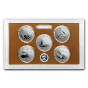 Set of five commemorative coins in a display case with a brown background.