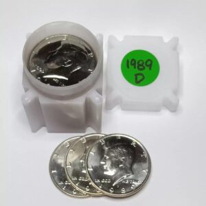 Silver coins and a white plastic container with a green label.